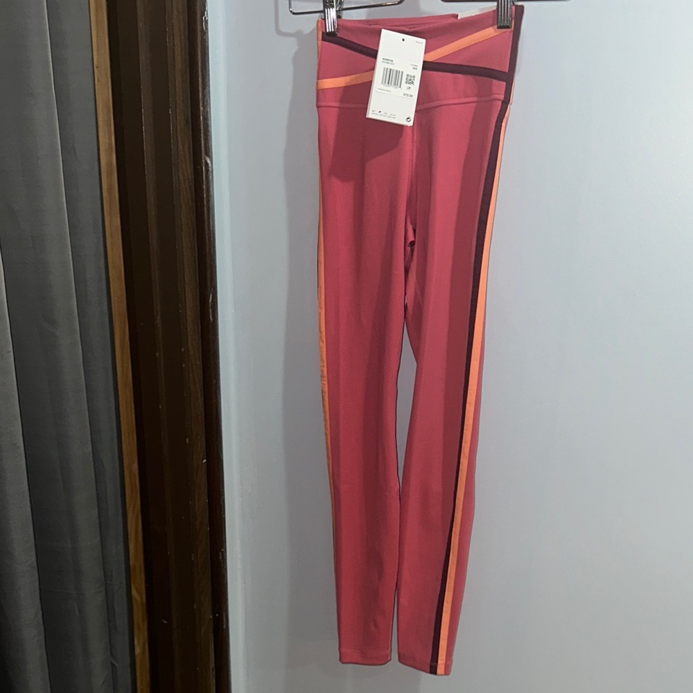 Nike Women's Vibrant Pink Leggings with Bold Orange Accents